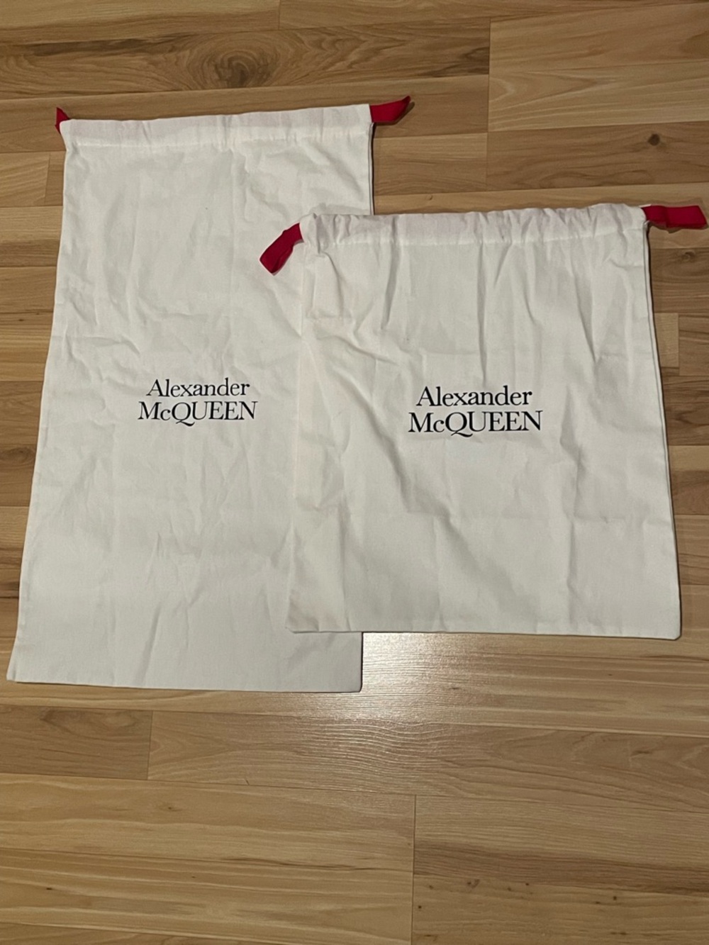 Alexander McQueen White Dust Bags with Red Drawstrings (Pair).
